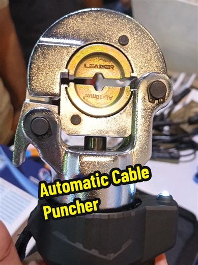 Chinese representative demonstrating an advanced wire punching device used for safe and professional cable connections. ⚡🔧 This smart tool comes with a 12-volt battery and built-in motor, so you only need to press one button and it punches the wire perfectly, preventing loose connections and sparking. A modern solution for electricians and cable technicians to make wiring faster, safer, and more efficient. #ElectricalTools #foryou #ElectricianLife #ChinaInnovation #WirePunching