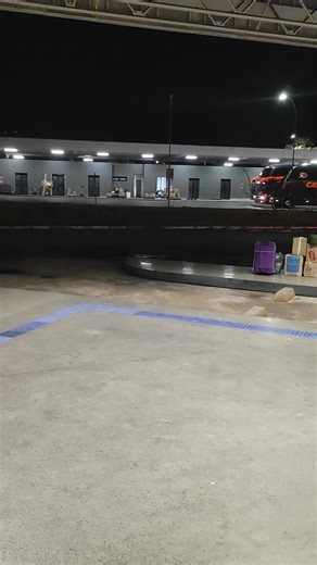 Bus Station Night Scene: Blue Express Departure