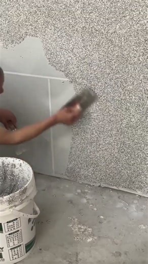 the process of plastering sand powder mixture on the walls on the outside of a building #popular