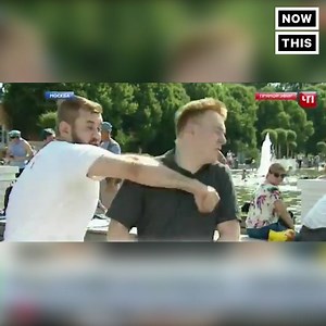 A Russian reporter was punched in the middle of a live broadcast | NowThis