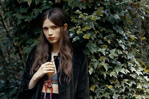 Watch two lovers get lost in a Prada forest