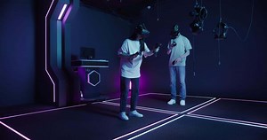 Two people in vr headsets standing in a room