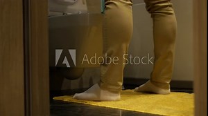 Urinary tract disease. A man relieves himself near the toilet. A man has problems with the genitourinary system and frequent urination. Prostate adenoma in humans.