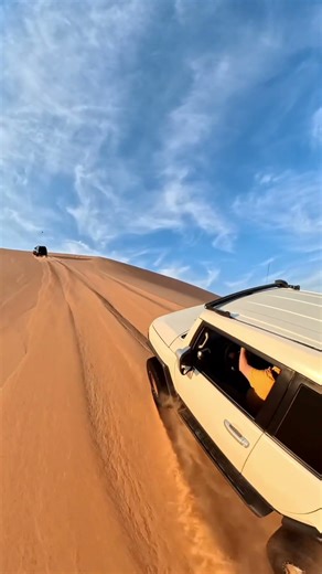 Dune bashings. Toyota FJ Cruiser off-road action in UAE desert