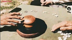 Tibetan farmers have special types of games. This one is a dice game that uses shells. #TibetTravel | China Plus Culture