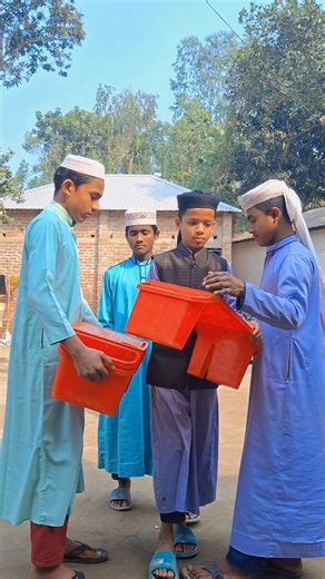 Huzoor is giving the students a table to read Quran Sharif