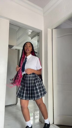 Energetic Dance Moves in School Uniform