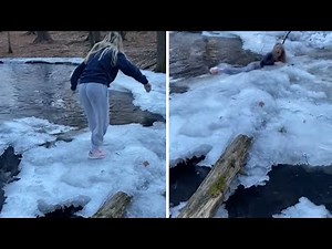 Epic fail: Woman slips and falls into frozen water #Shorts