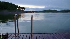 Pool handrail on the raft and water flowing in the lake