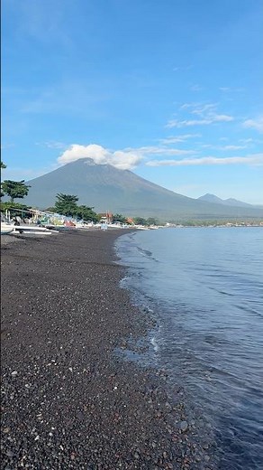 Black sand beach formed from ancient volcanic ash — one of Bali’s hidden gems 🌋✨ #beach #travel