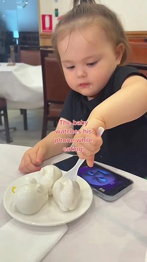 Baby Watching Phone While Eating: Adorable Moments