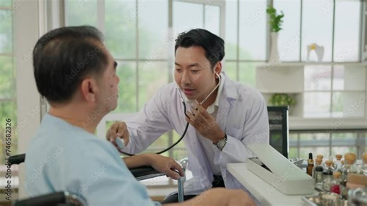 Young Asian doctor using stethoscope listen to the heartbeat of an elderly male patient. Skilled general practitioner giving healthcare medical advices to mature patient. Health care and medical