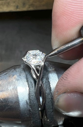 In honor of the eclipse, Ryan proposed to Jessica! Congratulations to you both on this special day! An engagement during an eclipse can signify transformation and a unique commitment - the perfect proposal setting. Designer Sophia has created a truly one-of-a-kind wrap-style engagement ring, featuring a hexagon diamond center. Get a good look at this unique diamond and watch jeweler Ayden craft this masterpiece! #greenlakejewelry #greenlakejewelryworks #customjewelry #customengagementring #engag