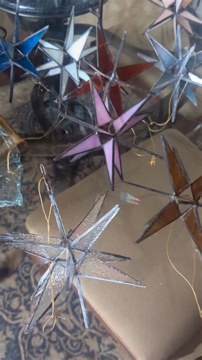 CatkinsCreations: Vintage, Antique, Repurpose Home Design on Instagram: "Hand Made Moravian Stained Glass Stars. Each star is about five inches diameter and ready to hang. Each multi pointed star is cut, ground, copper foiled, and soldered together by hand. It's a long process. These look beautiful hung in a window or gathered in a bowl. They make great gifts. Each star is $35. Pick your favorite color. There are currently 50 available. I take Venmo preferred or PayPal FF. #catkinscreations #han