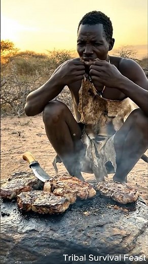 Hadzabe Hunter Cooking Meat on Hot Stone – Primitive African Cooking in the Wild! #shorts