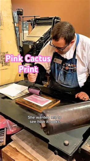 Printing a new linoleum cut of a cactus in pink ink