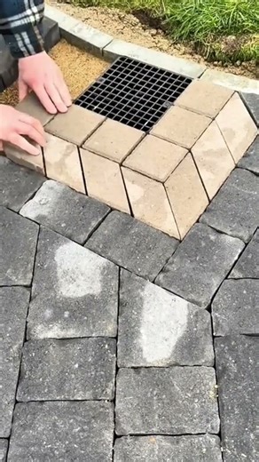 Installing drainage channel system beneath interlocking concrete paving blocks