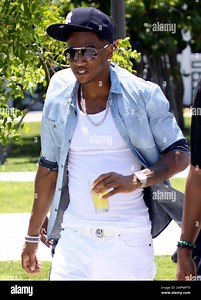 UK rapper Chipmunk films a video for his hit song "Take Off" featuring Trey Songz. The two rappers spent time on set filming, relaxing and enjoying the company of some bikini-clad women hired for the shoot. Miami, FL. 5/18/11 Stock Photo - Alamy