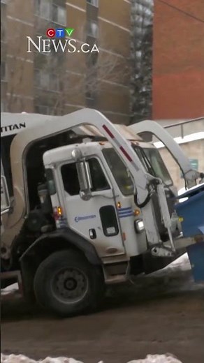 Garbage truck struggles on slippery back alley