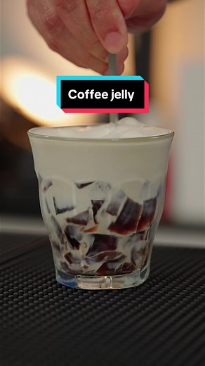 Coffee jelly …. . Ingredients .2 tablespoons hot water (approx : 30 ml) .1 (.25 ounce) package unflavored vegetable gelatin (10 gms) .2 cups fresh brewed coffee ( 470 ml) .2 or 3 tablespoons white sugar ( adjust as needed ) . 1.Stir together gelatin and hot water in a small bowl until gelatin dissolves; pour into a saucepan. 2. Stir in coffee and sugar, and bring to a boil over high heat. 3. Pour coffee mixture into a shallow, 9-inch square or 7x11-inch baking dish. Chill in the refrigerator unt
