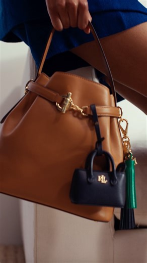 Lauren Ralph Lauren on Instagram: "The Medium Blaike: A luxurious take on the bucket bag, crafted for everyday wear and styled with #LaurenRalphLauren leather bag charms. Explore more accessories via the link in bio."