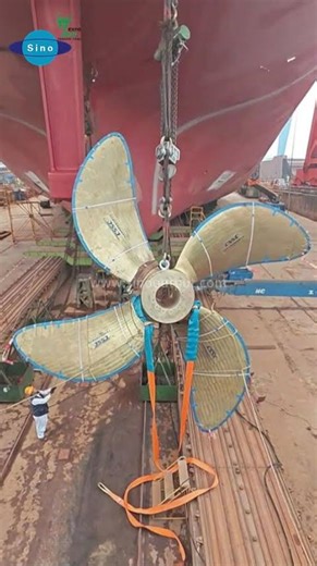 Safe hoisting of a large marine propeller, preparing for reliable propulsion at sea.