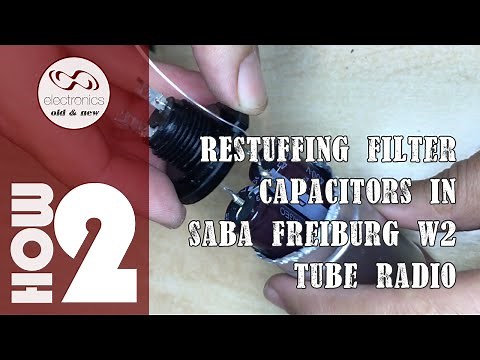 Re-stuffing filter capacitors in Saba Freiburg W2 (WII) tube radio.