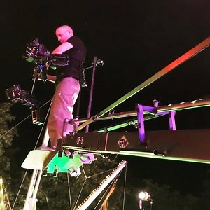 Steadicam Operator walks off GFM Crane as grip steps on to counterbalance. Grip Factory Munich - GFM www.gripsupport.com | Grip Rigs