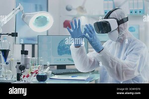 Scientist using VR headset and virtual reality to learn and discover new things Stock Video Footage - Alamy