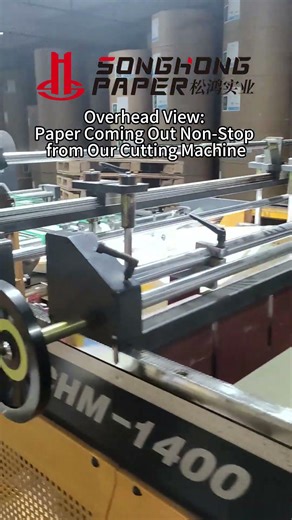 Overhead View: Paper Coming Out Non-Stop from Our Cutting Machine