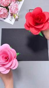 Title: Paper Rose Craft 🌹✨ Hashtags: #PaperRose #RoseCraft #DIYFlowers #HandmadeRose #EasyPaperCraft #CreativeDIY #PaperFlowerMaking #CraftingFun #BeautifulCraft #FlowerArt Steps: - Gather: Take red or pink paper, green paper, scissors, and glue. - Cut: Trim paper into petal shapes of different sizes. - Shape: Curl edges of petals slightly for a natural look. - Form: Roll a small piece to make the rosebud center. - Attach: Glue petals one by one around the center. - Layer: Keep adding larger pe