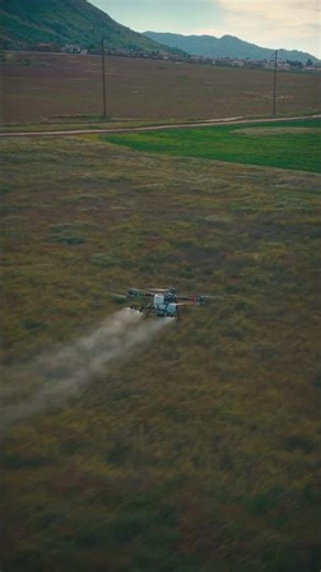 DJI Agras T100 spraying across terrain. Built for crop application. #t100 #agtech #dronespraying