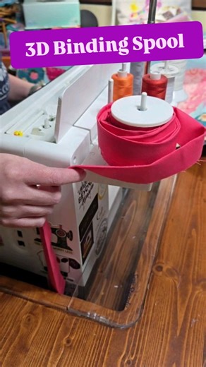 Adding binding to my flamingo quilt tonight with my 3D Binding Spool. No more twisted binding on my lap, no more binding all of the floor, and no more flopping off a holder. Wind it on, set it on a mast and it will smoothly spin off as you sew. Purchase from my website, Etsy, or tell your favorite quilt shop to order them from @modafabrics #handmade3d #quiltbinding #quiltersoftiktok #modafabrics | Handmade3D
