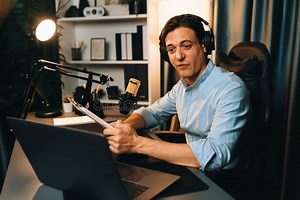 Broadcaster Reading Script Note To Listener in Warm Light at Night. Pecuniary. Stock Photo - Image of warm, streaming: 337058256