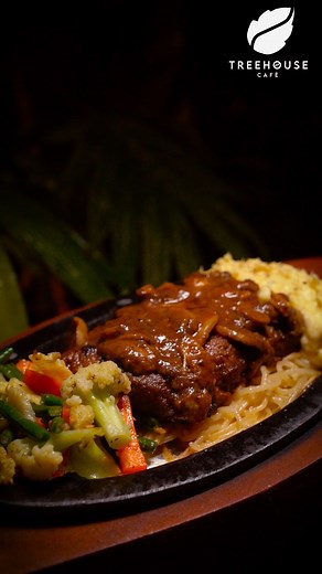 Treehouse Cafe Beef Steak with Mushroom & Pepper Sauce: Juicy, tender steak topped with a rich mushroom and pepper sauce. A flavorful indulgence crafted to perfection. 🥩🍄✨ | Treehouse Cafe