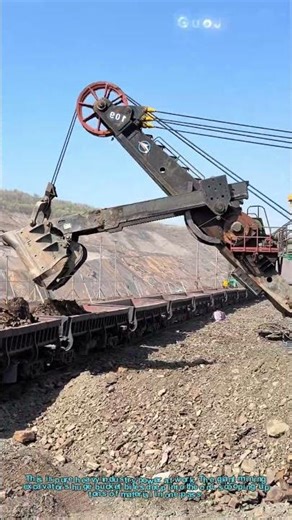 Massive Mining Excavator Loading Ore Into Train Cars