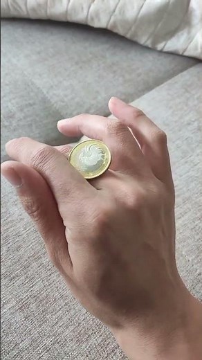 Master the Art of Coin Rolling Trick with Your Fingers