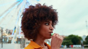 beautiful young woman vaping with an electronic cigarette and having fun blowing the dense smoke out
