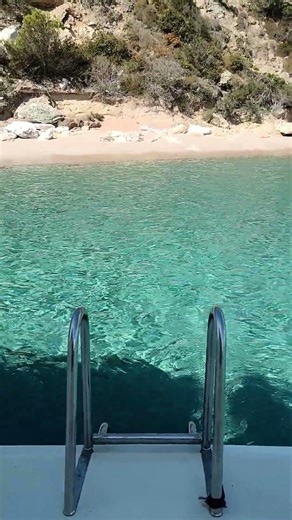 Corsica Catamaran Bali 54 landing almost on the beach crystal ear waters in France sailing the Med