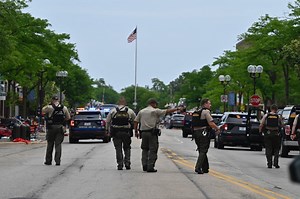 Police: Man wanted in connection with parade shooting in custody