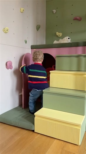 FeliFam | Italian Children Interiors on Instagram: "A completed playroom where every square meter supports a child’s development 🎠 Milan, Italy | 10 m² This completed project is an example of how smart spatial thinking transforms a small children’s room into a multifunctional space for development. The two-level structure combines a play kitchen, a window seating area, and an active zone with a climbing wall that develops motor skills and physical activity. The space is designed to support a ch