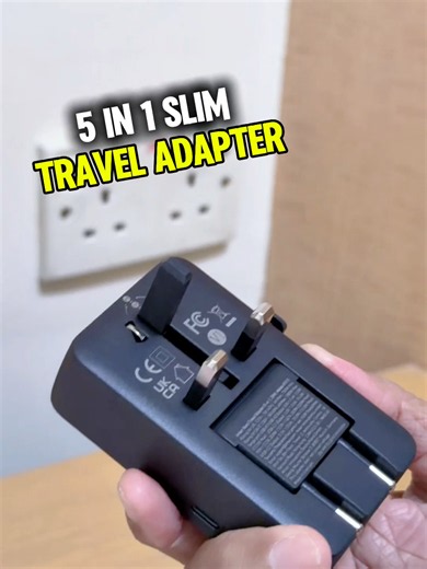 You can charge up to four USB accessories and one wall plug at the same time. Just look at how slim this travel adapter is. It's a five-in-one hub. The slider looks short, but the mechanism is firm, and it covers over 200 countries. Are you also looking for a slim travel adapter? Then get yours from the link below. ~ Adrian Lee @adrianvideoimage