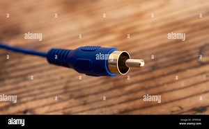audio-video analog cable on an old wood table background Stock Photo - Alamy