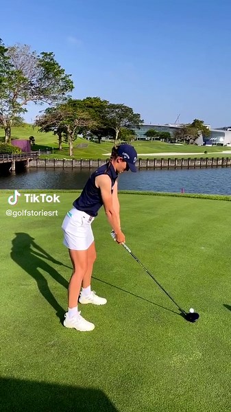 Young Woman Golfing on a Scenic Course