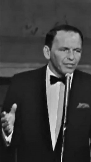 Frank Sinatra performs “You Make Me Feel So Young” at the Royal Festival Hall in London.