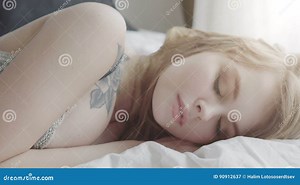 Beautiful Woman Sleeps in the Bedroom, Lying on Her Bed Stock Video - Video of morning, light: 90912637