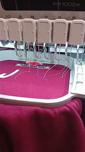 Adding in8tials to garments with a multineedle embroidery machine. Brother PR1000E embroidery.