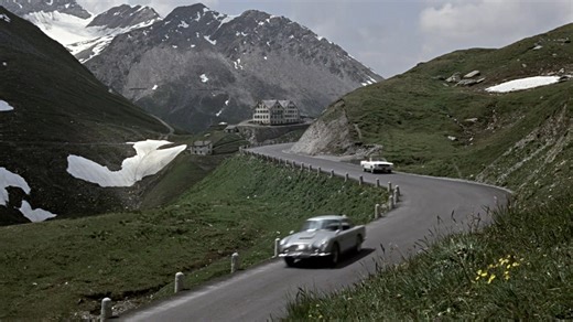 On the picturesque Furka Pass in the Swiss Alps, Bond (Sean Connery) meets Tilly Masterson (Tania Mallet) in GOLDFINGER. | James Bond 007