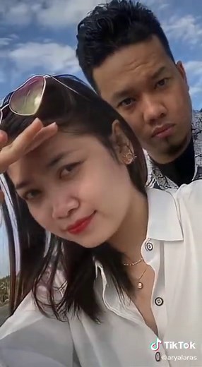 Beach Fun: Couples Playful Moments on Sandy Shores