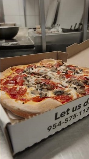 Medium pizza with pepperoni onions and mushrooms fresh